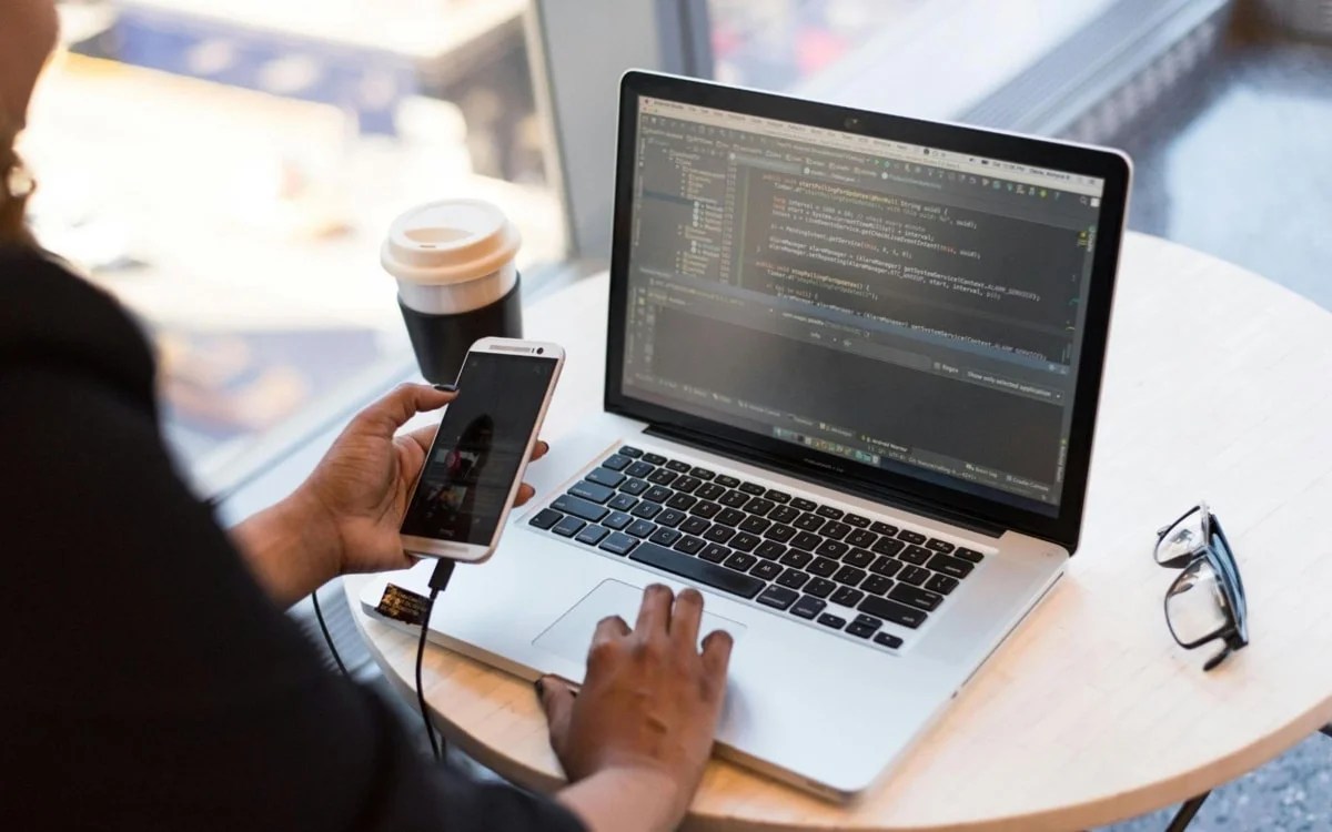 website owner or developer working on a laptop