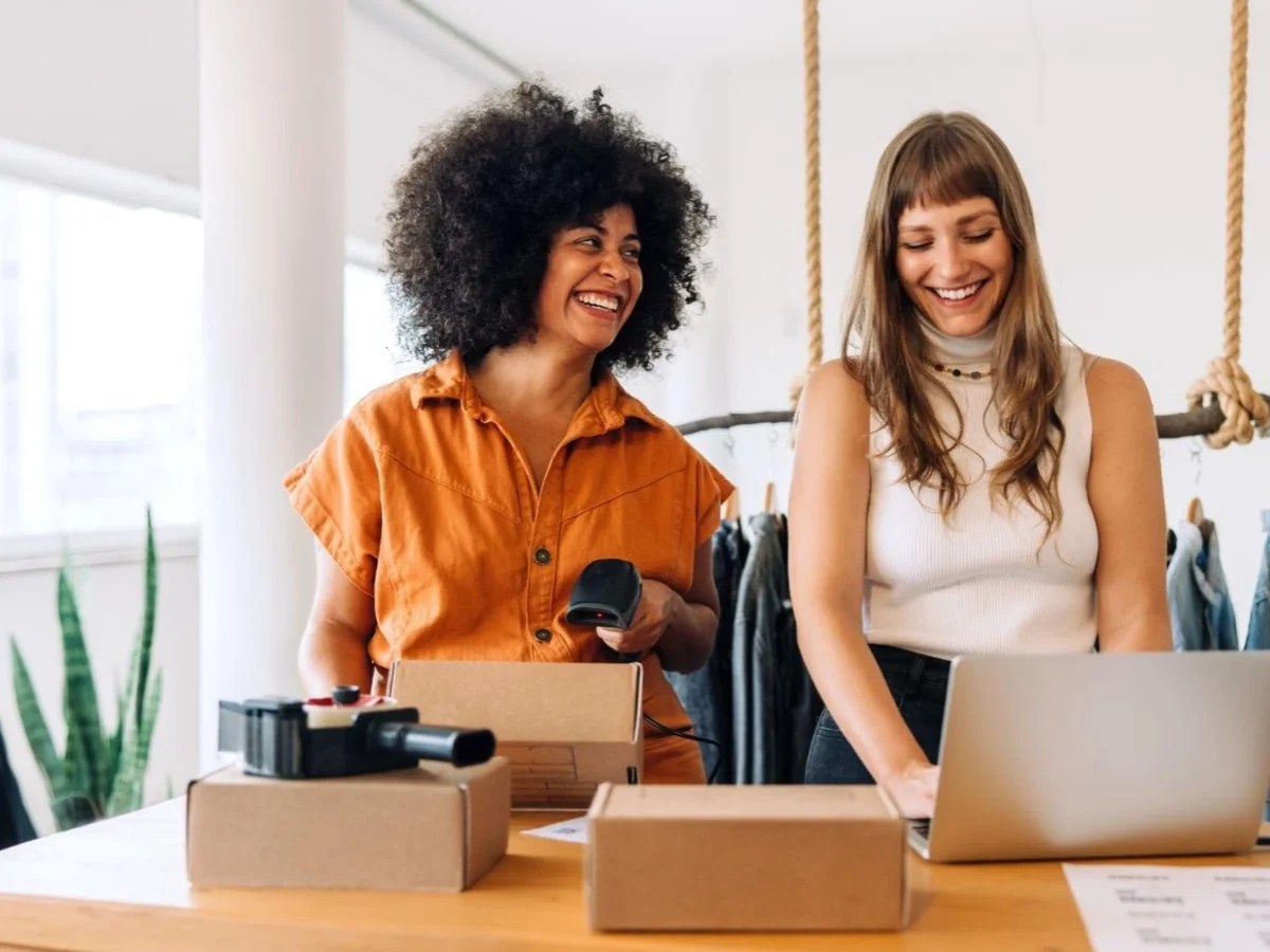 two women packing products to ship